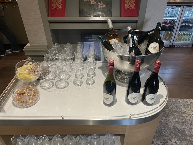 a table with wine bottles and glasses