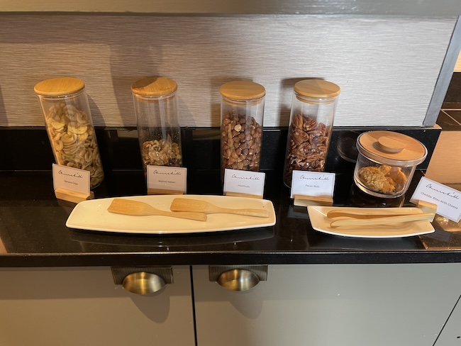 a counter with different containers of food