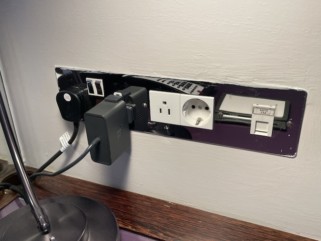 a power outlet with plugs and cords