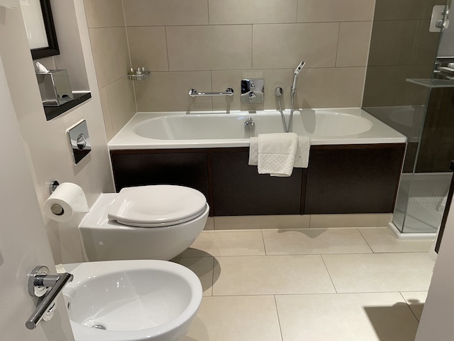 a bathroom with a bathtub and toilet