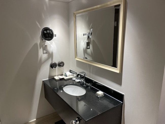 a bathroom with a mirror and sink