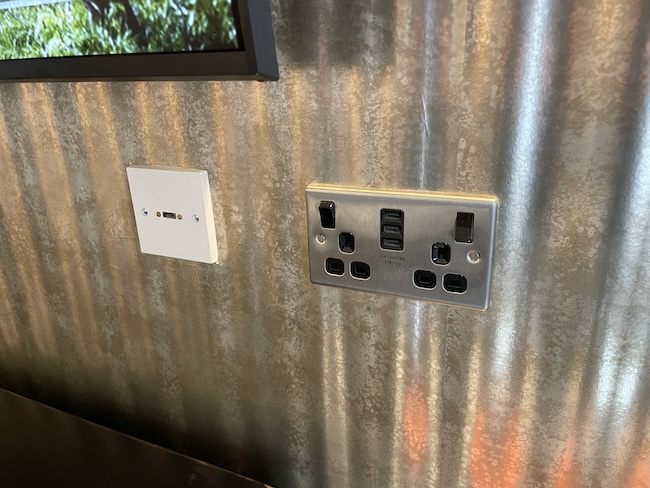 a wall outlet and a tv