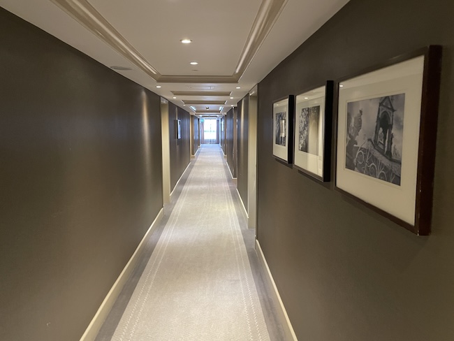 a long hallway with pictures on the wall