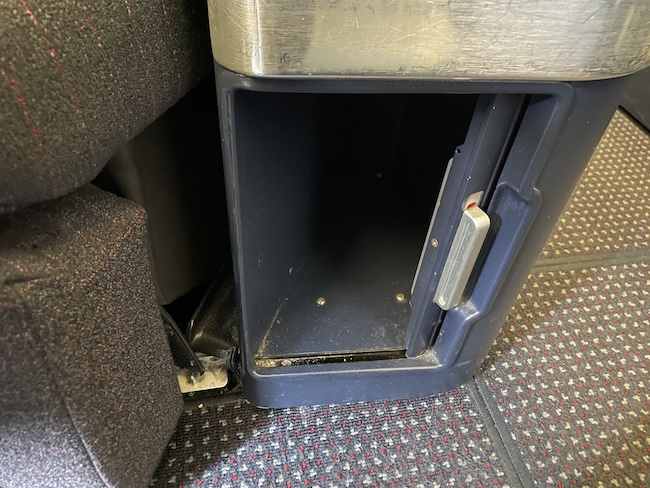 a small metal box with a door open