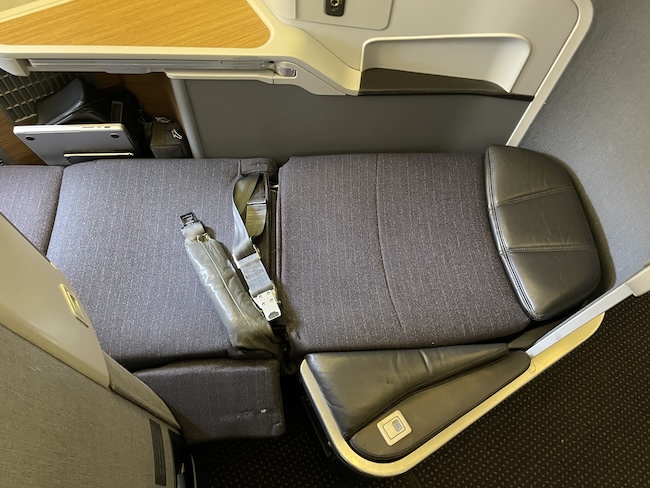 seat in an airplane with seat belts