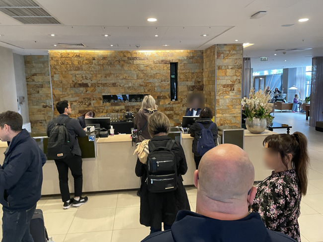 a group of people standing in front of a counter