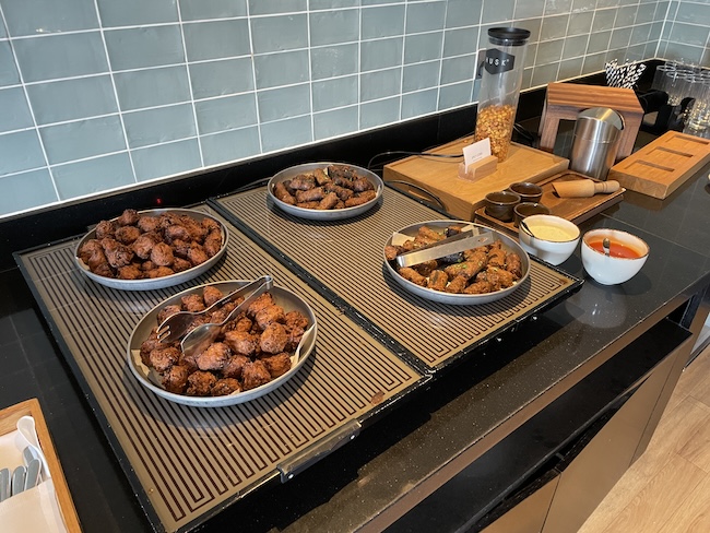 a group of bowls of food on a counter