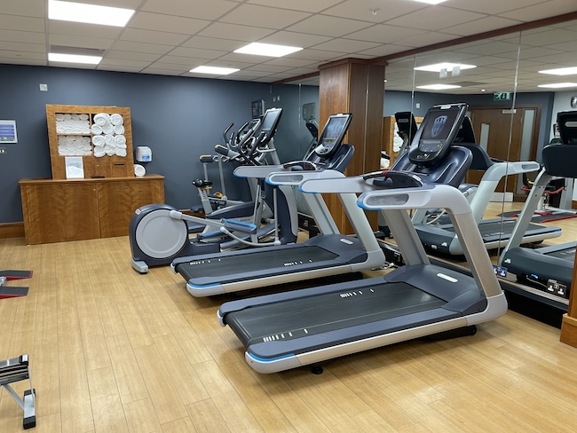 a room with treadmills and exercise equipment