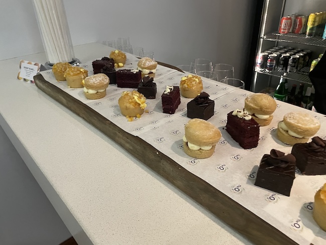 a table with many small desserts on it