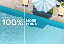 an umbrella next to a pool