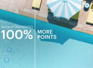 an umbrella next to a pool