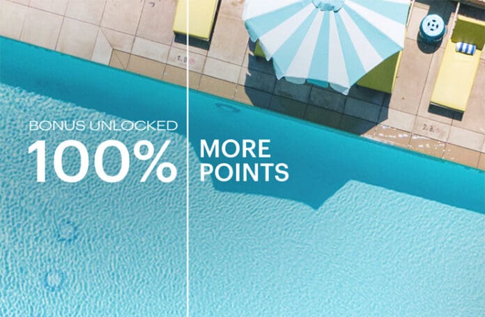an umbrella next to a pool