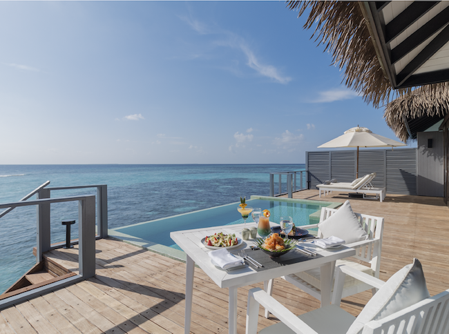 a table with food on it by a pool