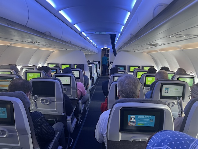 a group of people sitting in an airplane