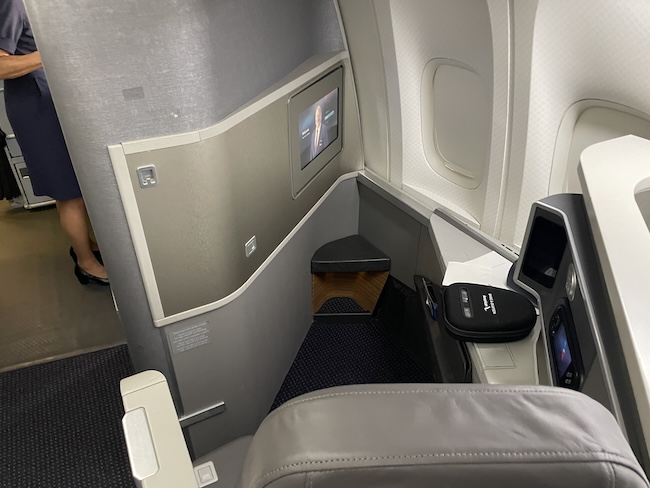 a seat and screen in an airplane