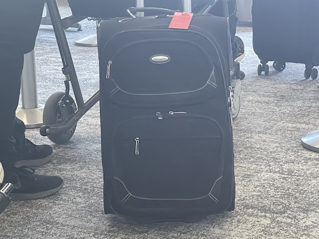 a black luggage on the floor