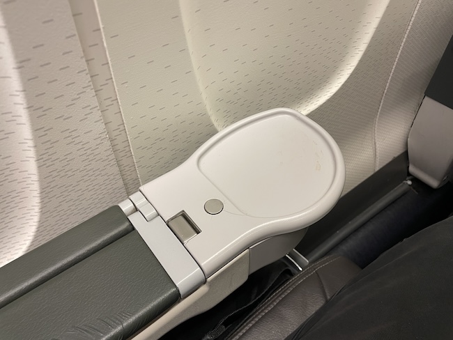 a seat arm rest in a plane