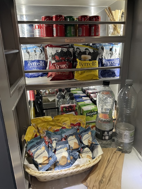 a shelf with food and drinks