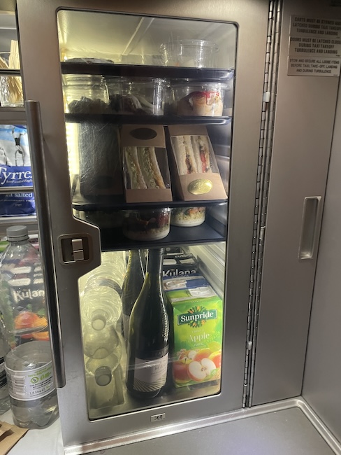 a refrigerator with food and drinks