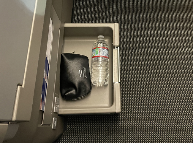 a bottle of water in a drawer