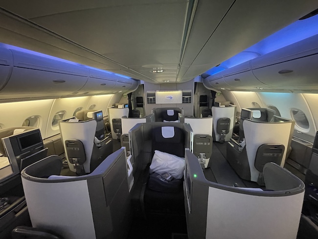 an airplane with seats and a blue light