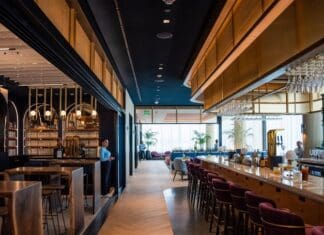 a bar with chairs and tables