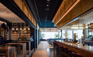 a bar with chairs and tables