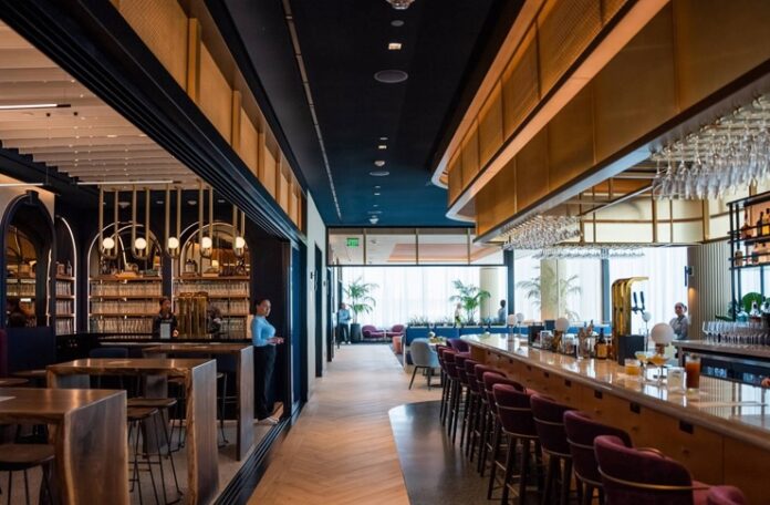 a bar with chairs and tables