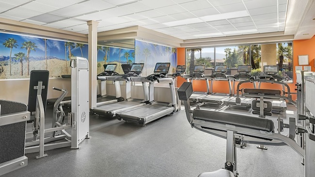 a room with treadmills and exercise equipment