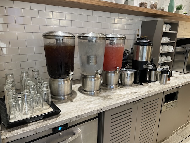 a group of coffee maker containers on a counter