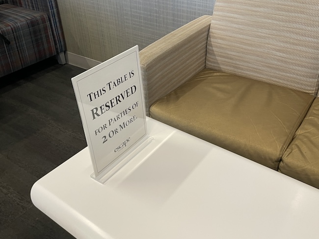 a table with a sign on it