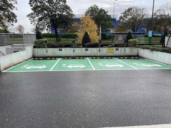 a parking lot with green and white markings