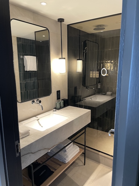 a bathroom with a mirror and sink