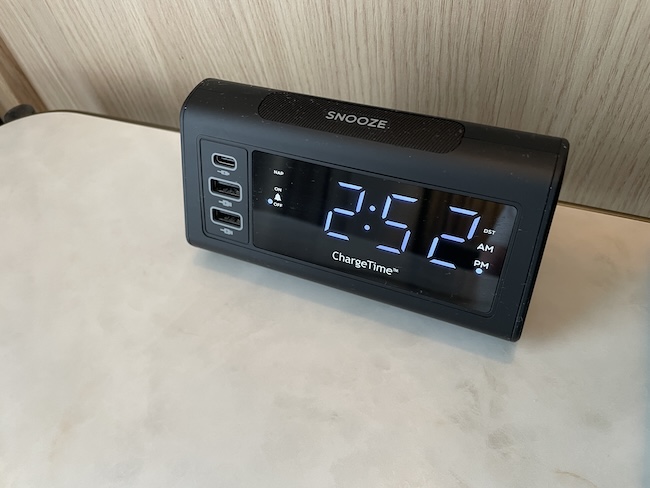 a black digital clock on a white surface