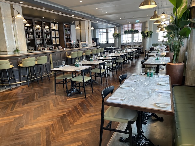 a restaurant with tables and chairs