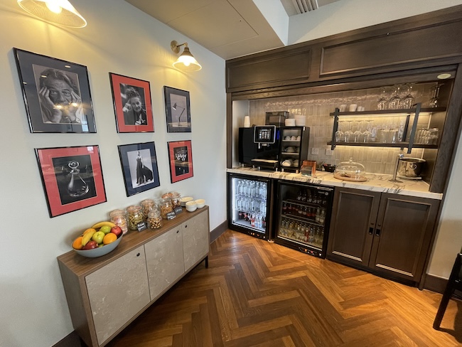 a room with a fridge and shelves