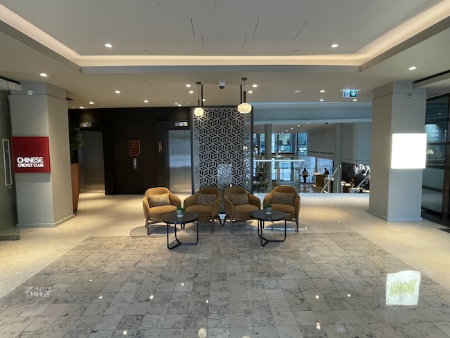 a lobby with chairs and tables