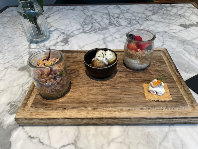 a wooden tray with food on it