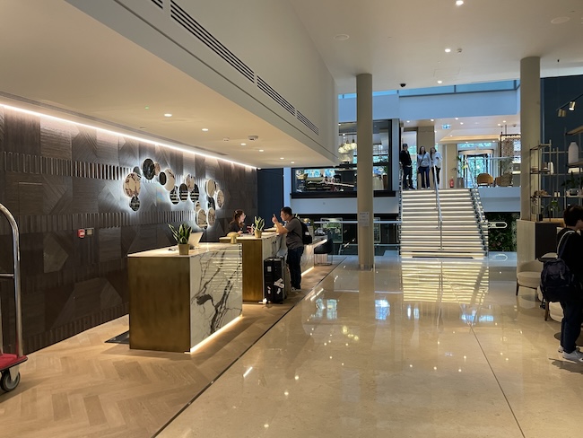 a lobby with a marble floor and a marble counter