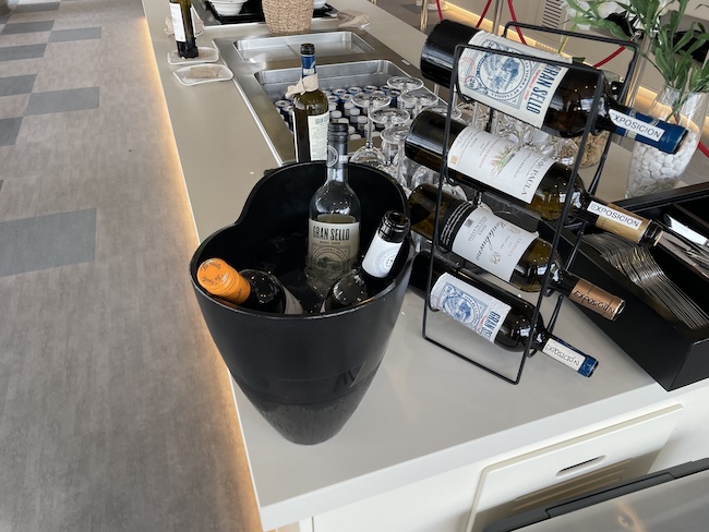 a wine bottles in a bucket on a counter