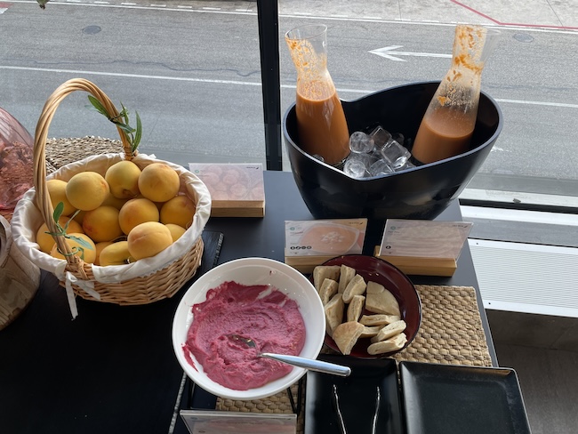 a table with fruit and ice cream