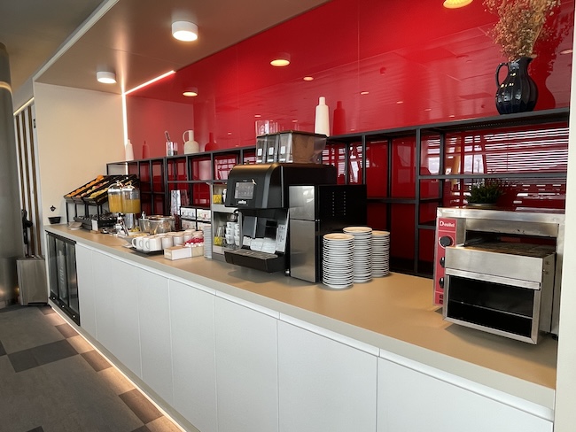 a counter with a variety of coffee machines