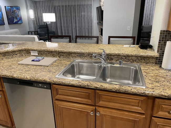 a kitchen with a sink and dishwasher