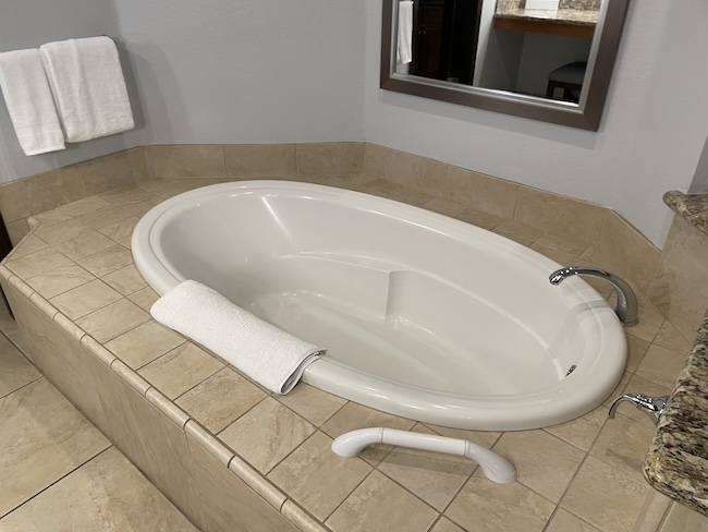 a white bathtub in a bathroom