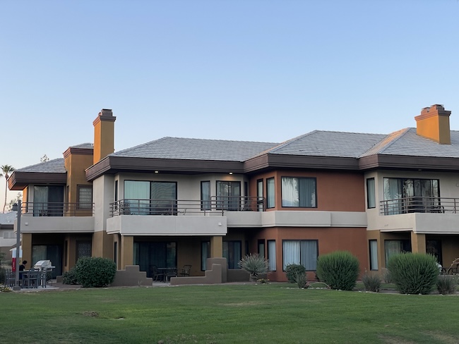 a building with a lawn and grass