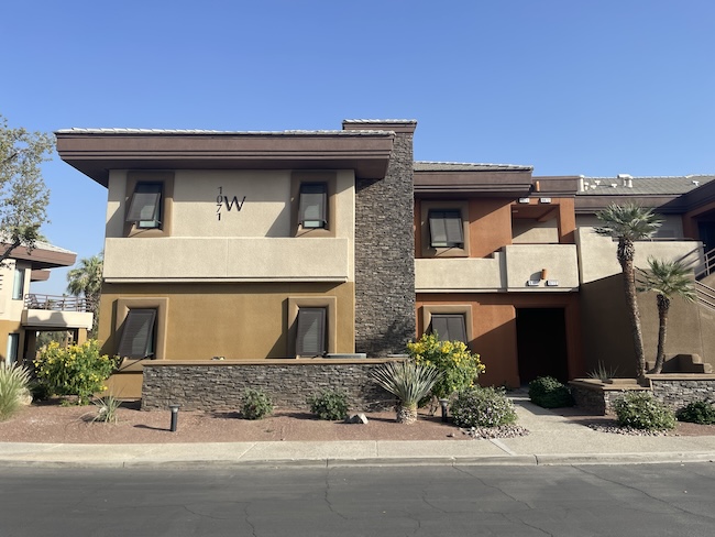 a building with a stone wall and a stone wall