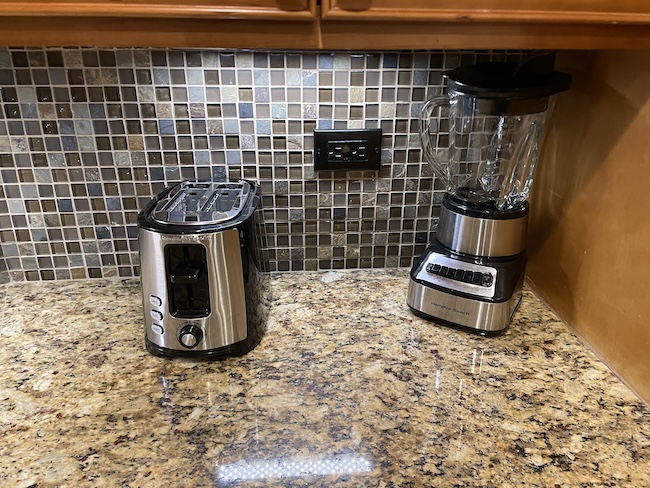 a blender and a toaster on a counter