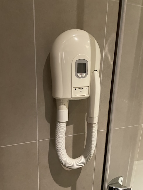 a hair dryer on a wall