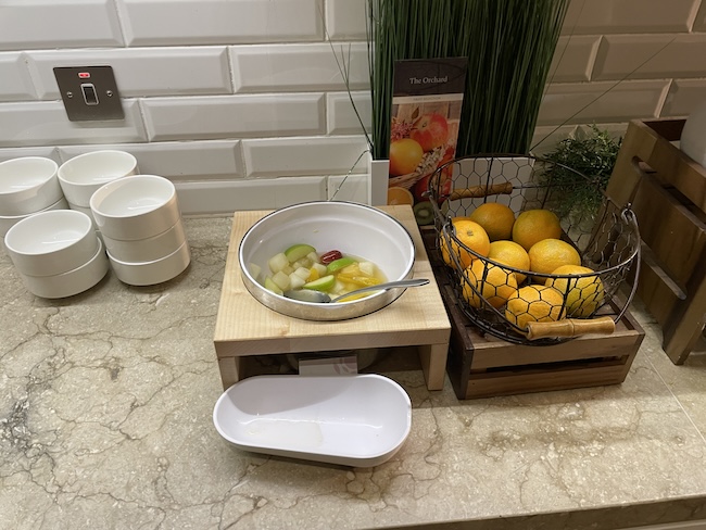 a bowl of fruit on a counter