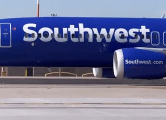 a blue airplane with white text on it